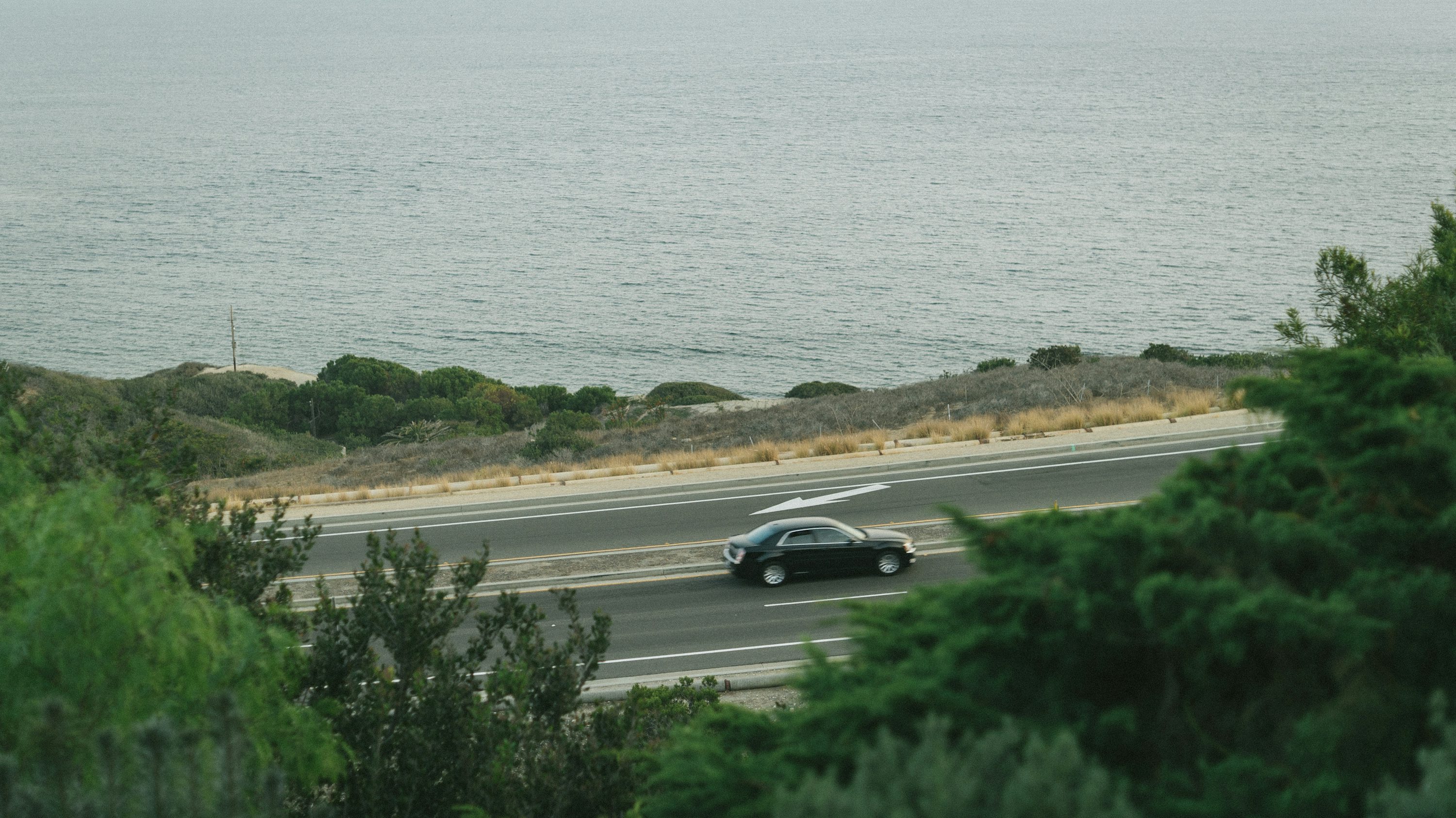 Vehicle on a California coastal road